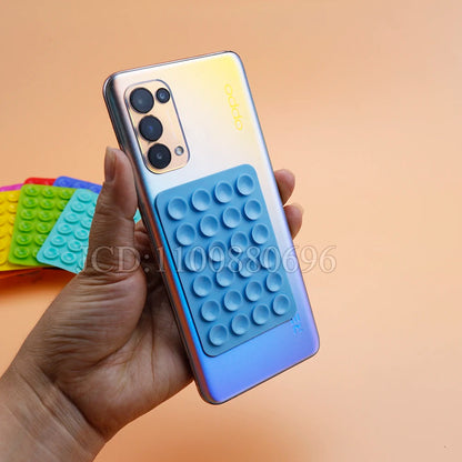 Support adhésif silicone multifonction pour smartphone – Pliable & repositionnable